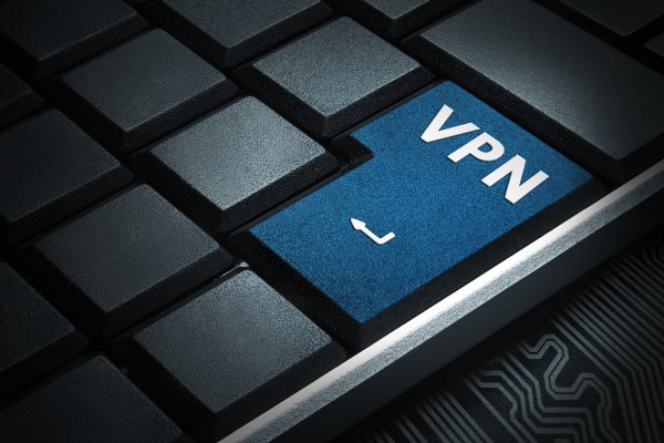 surfshark vpn service features benefits blue vpn key on computer keyboard